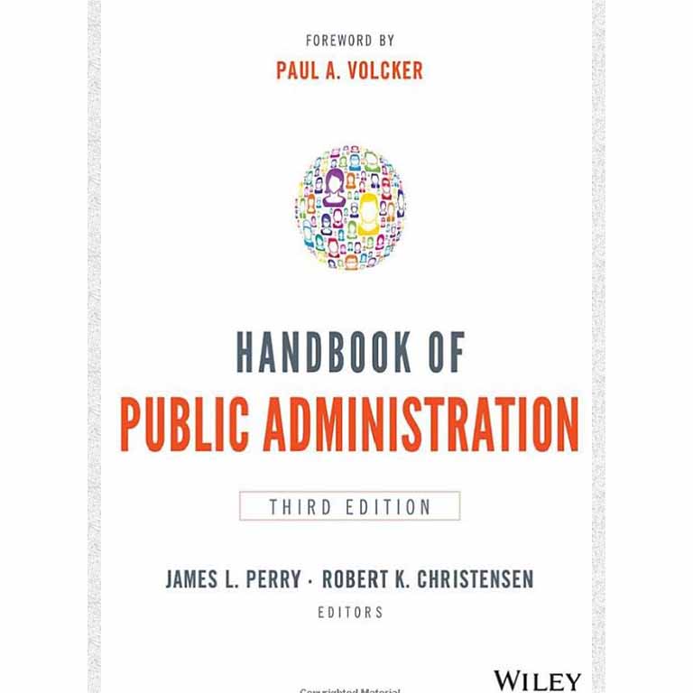 James Barnes in front of a wall of photos. 