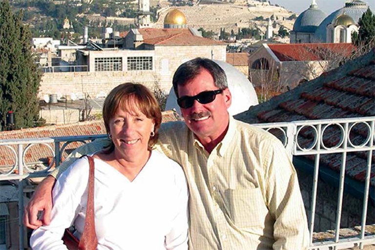 Couple on balcony in foreign country