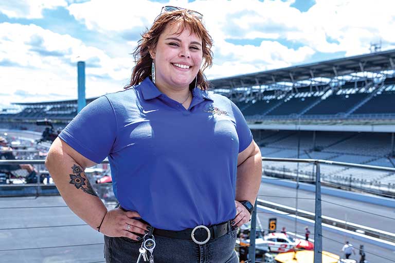 Student with race track in the background